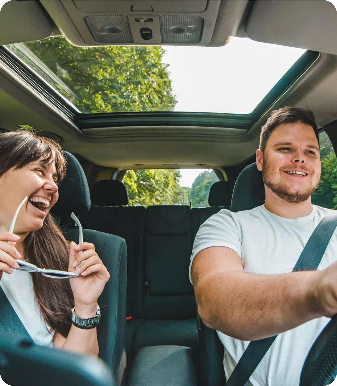 Driver and passenger in a car during a trip