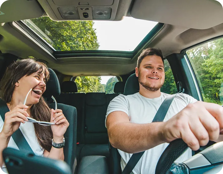 Driver and passenger in a car during a trip