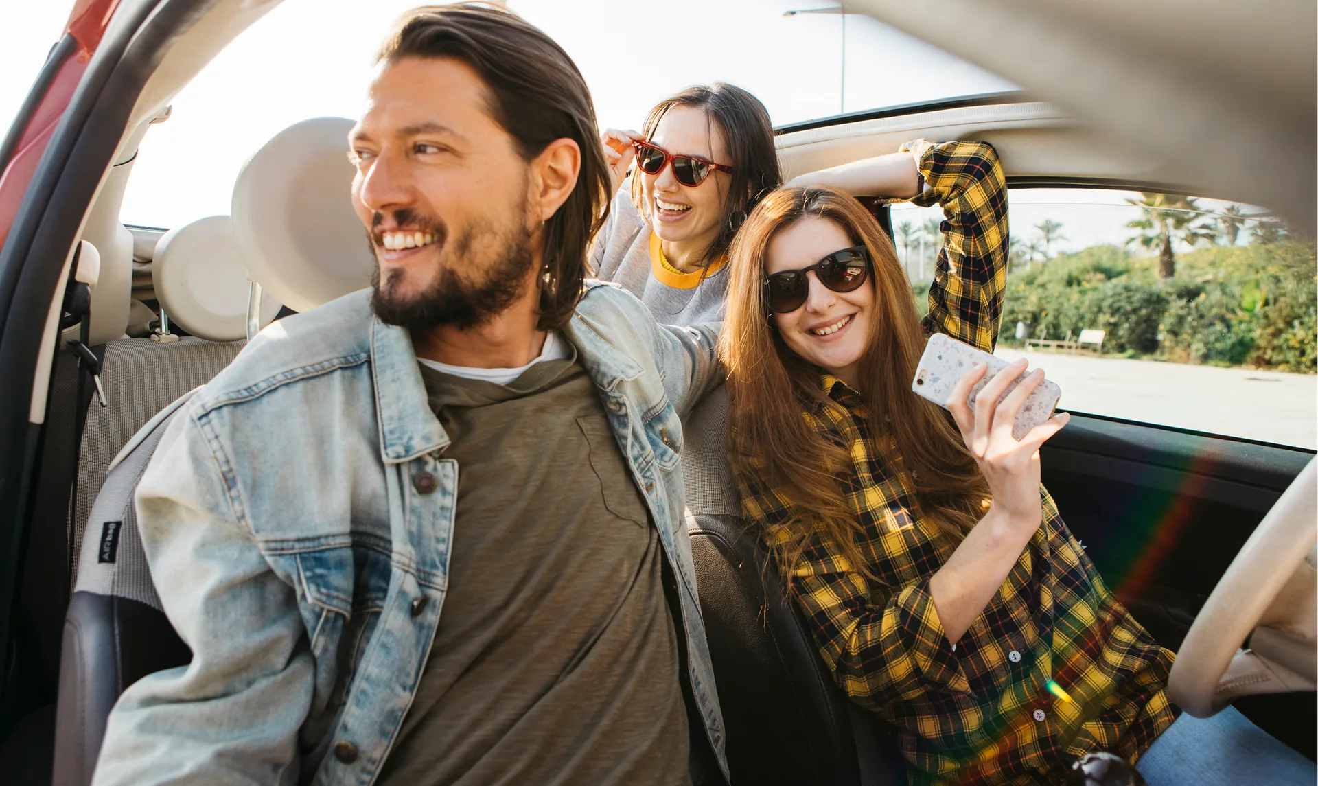 Happy passengers in a car - community travel
